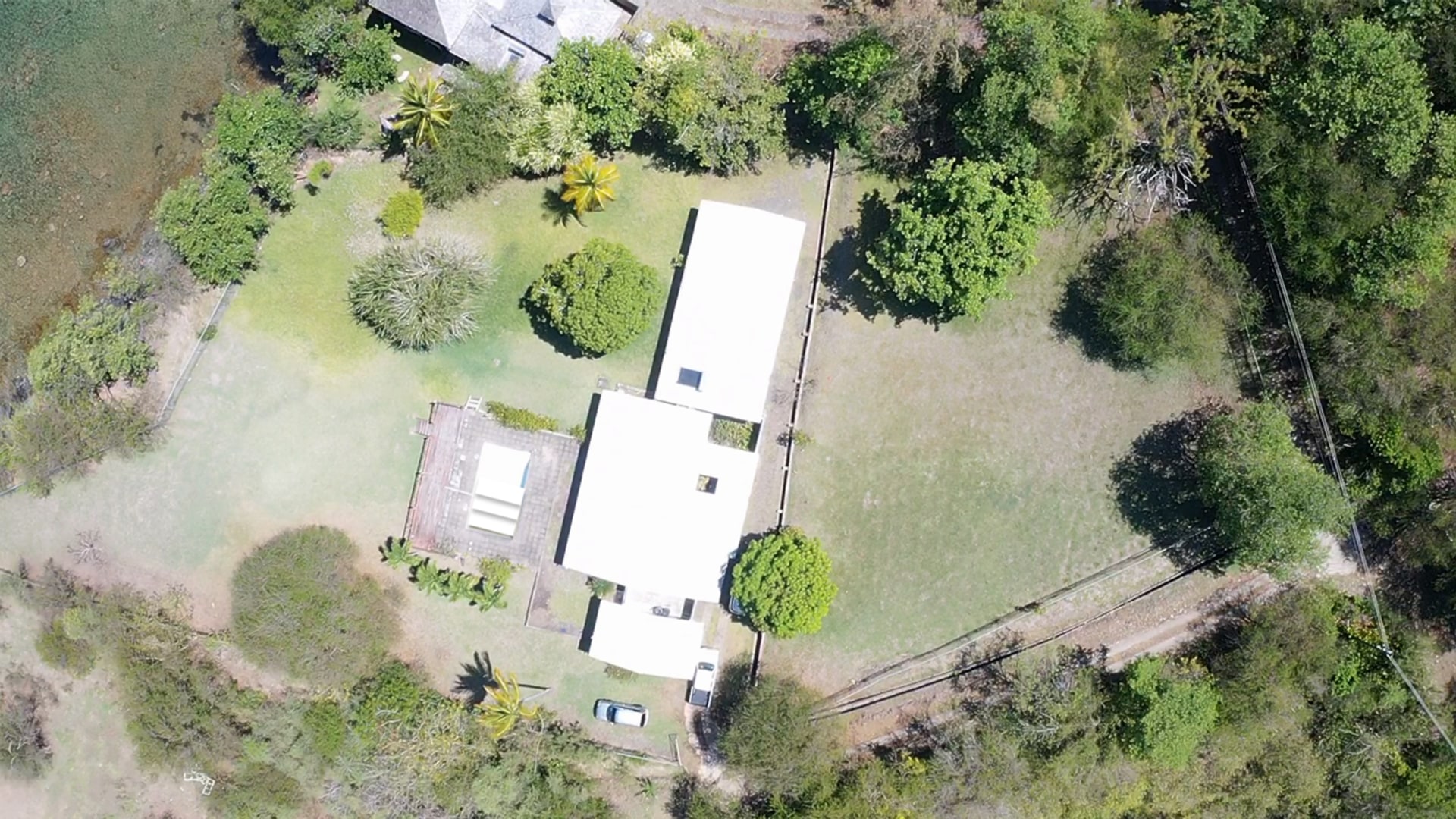 Waterfront Property in Cap Estate – Prime Real Estate with Ocean Views Located at the edge of Cap Estate in Becune Point, this property offers stunning views of both the Caribbean Sea and Pigeon Island. Set on a generous 51,782 square feet of land, the property includes both freehold and King's Chain lands, with 27,606 square feet leased from the government. The 2,000-square-foot house, while in need of renovation, provides an excellent opportunity for investment or redevelopment. The spacious living area features double doors that open to the front patio and pool area, which also requires renovation. There is a small detached maid’s quarter adjacent to the main house. Property Layout & Features: 3 bedrooms: Two of the bedrooms share a well-designed, spacious bathroom, while the master bedroom includes an en-suite bathroom and generous wardrobe space. The home includes 3 cisterns and a pump system with a capacity of 400 gallons each, providing ample water storage. Prime Location & Potential: This property offers exceptional potential due to its waterfront location and strategic proximity: Close to Pigeon Island National Landmark, a 44-acre islet with rich historical and cultural significance. Walking distance to the beach, making it ideal for either a private family home or an investment opportunity. With its ideal location and expansive land, this property presents a unique opportunity for someone looking to renovate and capitalize on the beauty and convenience of Cap Estate living. Whether for a family home or as a lucrative investment, this property offers the best of both worlds